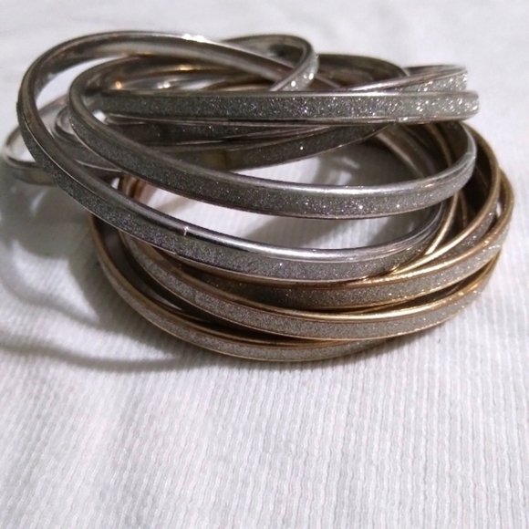 Jewelry - Two sets of glittery intertwined bangles
